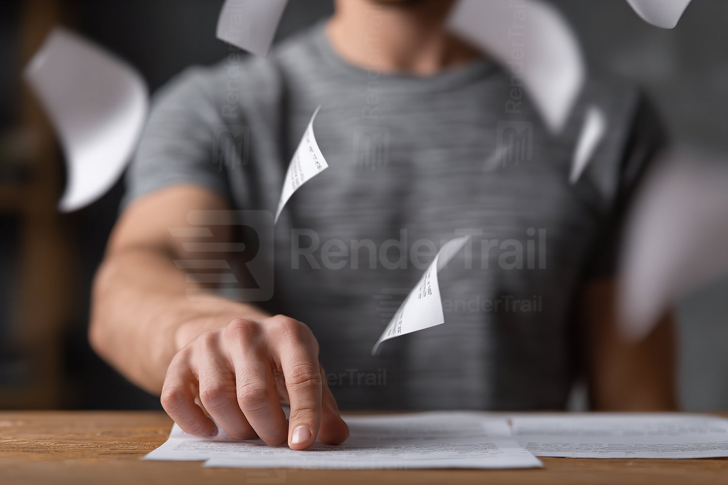 Person sorting through papers in a cozy indoor setting during the evening