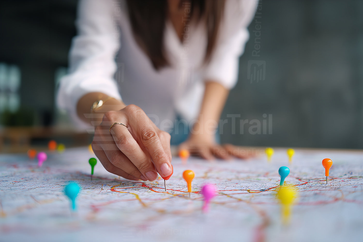 Mapping travel plans with colorful pins and a detailed map in a modern workspace setting during the day